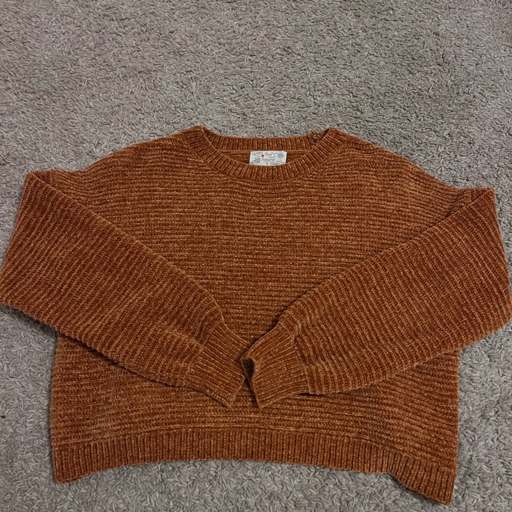burnt orange colored sweater